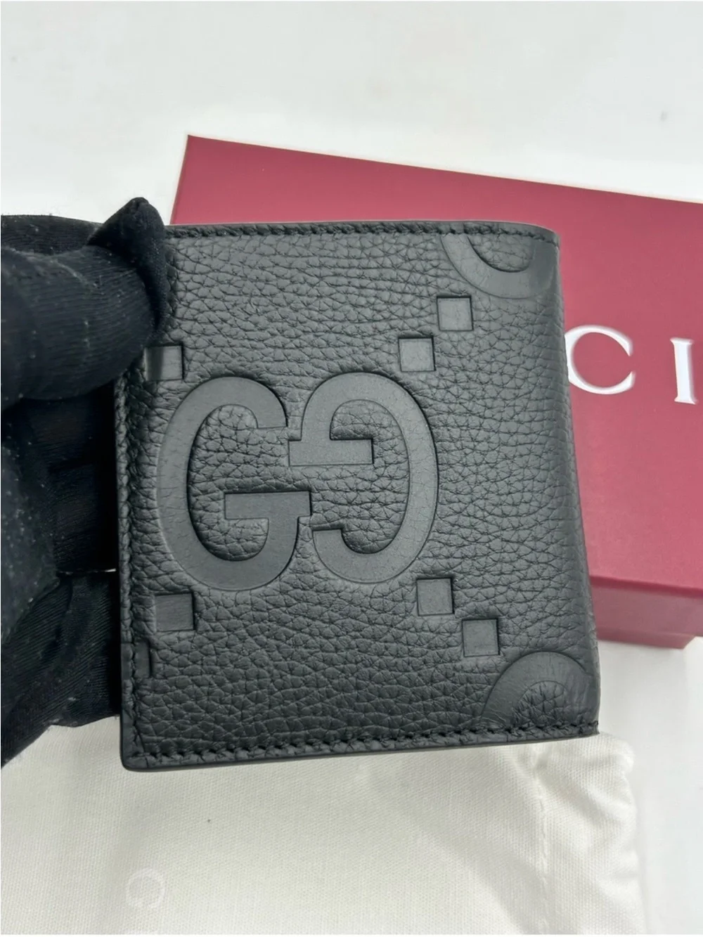 Gucci Black jumbo GG Leather Bifold Wallet.
